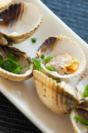 Fresh cooked cockles, ready to eat. Typical tapas from Spain.