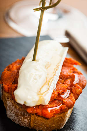 Spanish sobrasada with brie cheese tapas.の写真素材