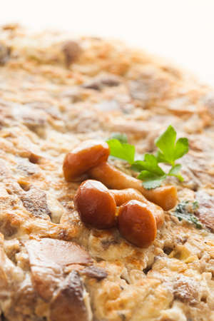 Tortilla de patatas with mushrooms. Ready to eat!の写真素材