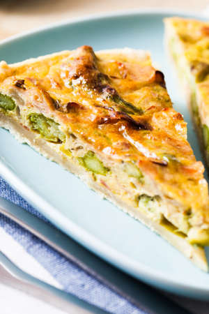 Detail of an asparagus quiche, ready to eat 