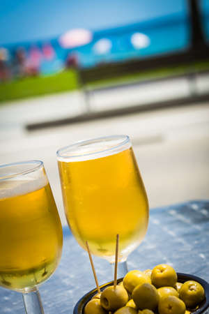 Two cold beers in the beach の写真素材