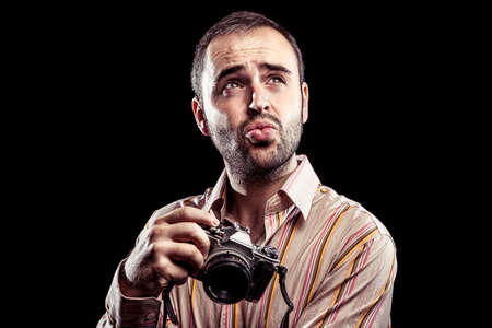 Vintage photographer making an expression and looking up.の写真素材