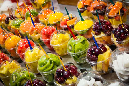 Variety of fruit salad in La Boqueria market in Barcelona の写真素材