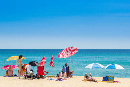 CALONGE, SPAIN - 25 JUNE: Tourists enjoy at the beach in the summer in the Calonge beach, small village in Costa Brava. Calonge July 12, 2013.のeditorial素材