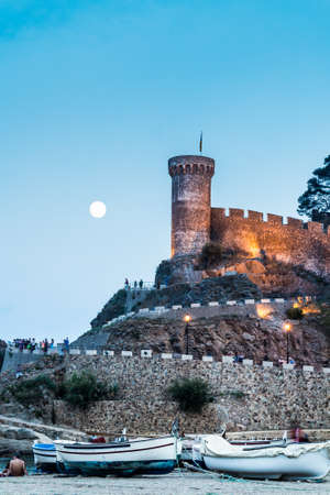 Tossa de mar at night with a full moon, vertical edition のeditorial素材