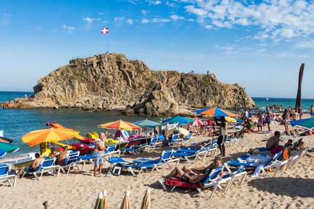 BLANES, SPAIN - 28 JULY  Tourists enjoy at the beach in the summer in the Blanes beach, small village in Costa Brava  Blanes July 28, 2013 のeditorial素材