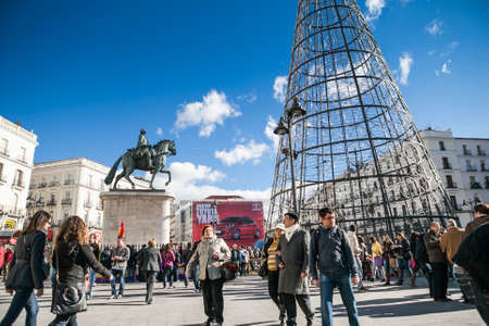 MADRID, SPAIN - 06 DECEMBER: People goes to buy the Christmas presents in Puerta del Sol, the main square in Madrid. Madrid december 06, 2011のeditorial素材