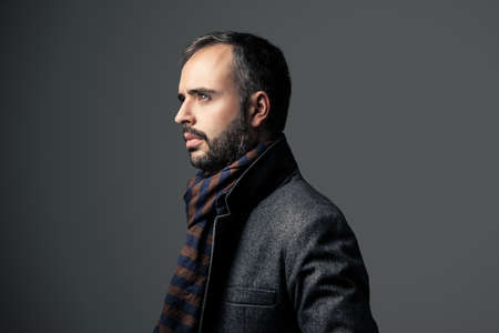 Serious and stylish man in a grey background.のeditorial素材