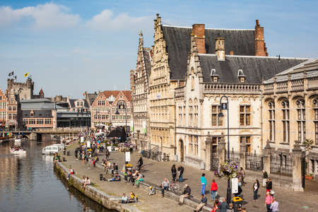 GHENT, BELGIUM - 27 SEPTEMBER: Pople walk and realx near the river in Ghent, Belgium. September 2013.のeditorial素材