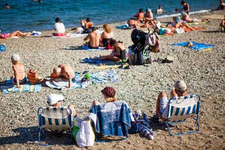 COLLIURE - SEPTEMBER 14: Tourists relax in the beach in the small village of Colliure, south France. September 14, 2013 Colliure, France.のeditorial素材