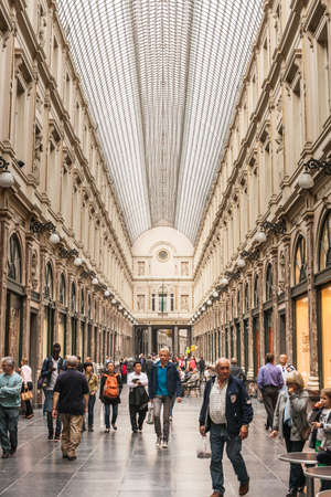 BRUSSELS - SEPTEMBER, 25: People shop in Saint Hubert Gallery in Brussels, famous by its high end shops. September 25, 2013 Brussels.のeditorial素材