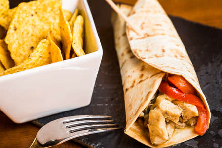 Meat burrito with nachos.の写真素材