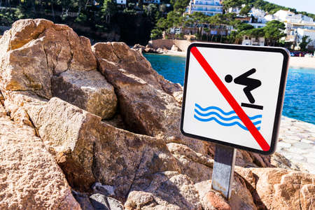 Swim prohibition sign in a sunny day.の写真素材
