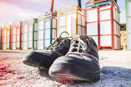 Detail of sport shoes in a beach.の写真素材