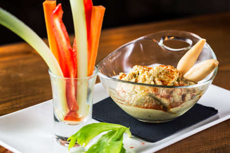 Bowl of hummus ready to eat.
