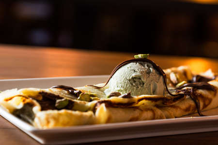 Delicious pistachio ice cream with chocolat crepe.の写真素材