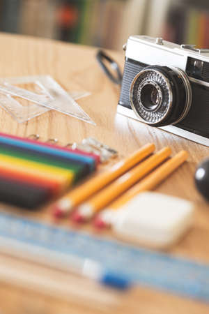 Some school supplies, ready to back to school, focus on vintage camera.の写真素材