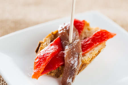 Typical spanish pincho: Anchovies with pepper.の写真素材
