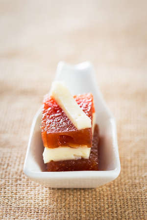 Delicious snack: fresh quince with cheese.の写真素材