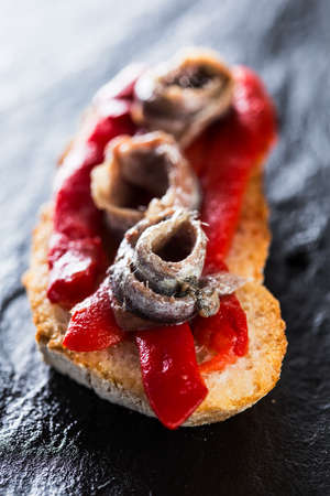 Typical spanish pincho: Anchovies with pepper.の写真素材