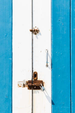 Old blue door painted in blue.の写真素材
