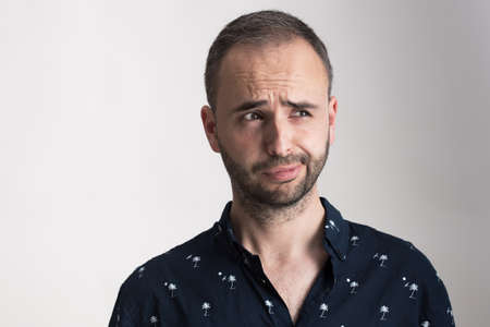 Bearded man making funny epxression portrait.