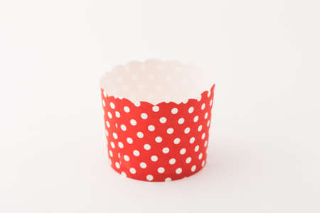 Red muffin or cupcake tin isolated on white background.の写真素材