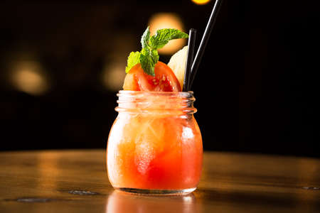 Tomato summer cocktail in a barの写真素材