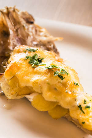 Monkfish tail with gratin garlic and potatoes.