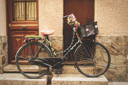 Vintage decorated bicycle in a street.の写真素材