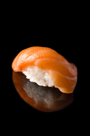 Perfecte salmon nigiri isolated on black background.の写真素材