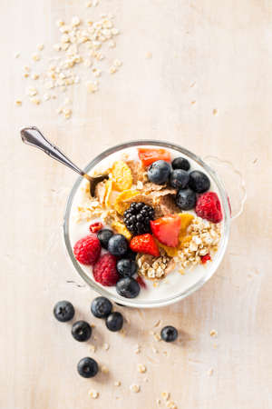 Tasty oatmeal porridge with different berries. Top view.の写真素材