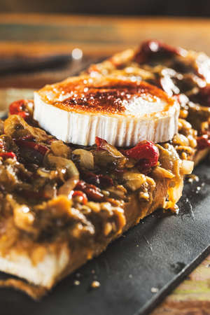 Traditional italian bruschetta with goat cheese and vegetables.