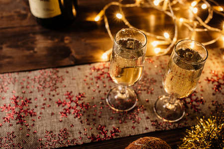 Two champagne glasses in christmas rustic set.