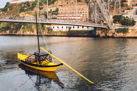 Typical view of Ponte Luis II with yellow boat.