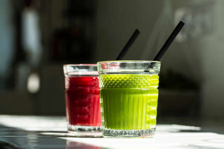 Red and green detox juice glass  with copy space.の写真素材