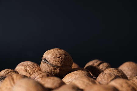 Walnuts on a dark background. Nutcracker close-up.