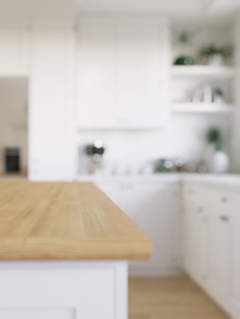 Wooden countertop, empty surface to place your goods, with a blurred kitchen background in the background.の写真素材