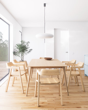 A beautifully decorated modern minimalist dining room filled with abundant natural lightの写真素材
