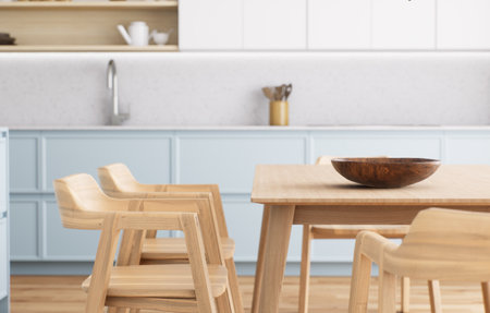A modern minimalist kitchen with light wood furniture creates a warm and stylish atmosphereの写真素材