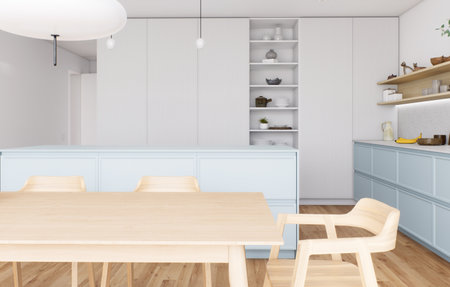 A beautiful modern minimalist kitchen with light wood elements and soft blue accentsの写真素材