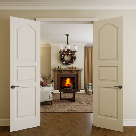 A cozy living room, beautifully decorated with Christmas decor and invitingly open doors.の写真素材