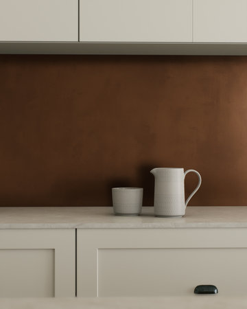 A minimalist kitchen with accents in earth tones and elegant dishes.の写真素材