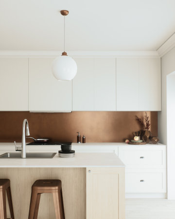 A stylish modern kitchen with beautiful copper accents and a minimalist designの写真素材