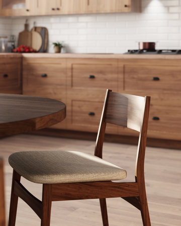 Elegant wooden chair with a light fabric seat against the background of a modern kitchen.の写真素材
