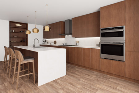 A modern kitchen with beautiful woodwork and sophisticated and stylish appliancesの写真素材
