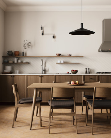 A modern minimalist kitchen with wooden furniture and a captivating pendant lightの写真素材