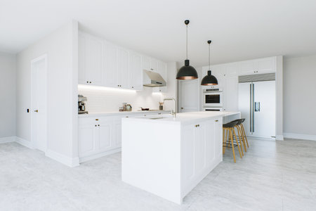 Stylish white kitchen with island, black chandeliers, appliances and utensils.の写真素材
