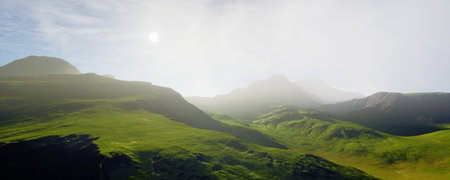 Lush green hills flourish under a bright blue sky filled with beautiful, fluffy cloudsの写真素材