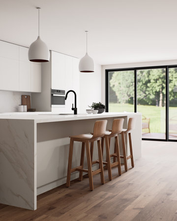 A beautiful modern kitchen interior featuring abundant natural light and a spacious, open layoutの写真素材